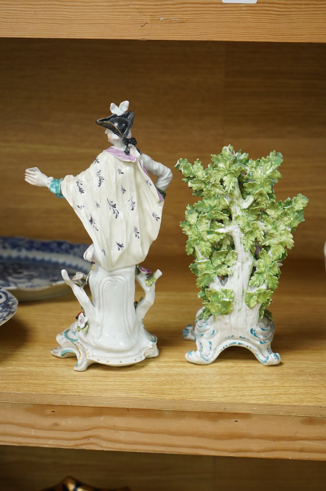 A Derby figure of a gentleman, c.1760, and a Continental porcelain figure, pseudo Bow mark, tallest 26cm high (2)